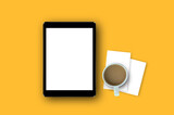 Laptop and coffee cup, paper with on yellow background orange.top view workplace business advertising marketing.