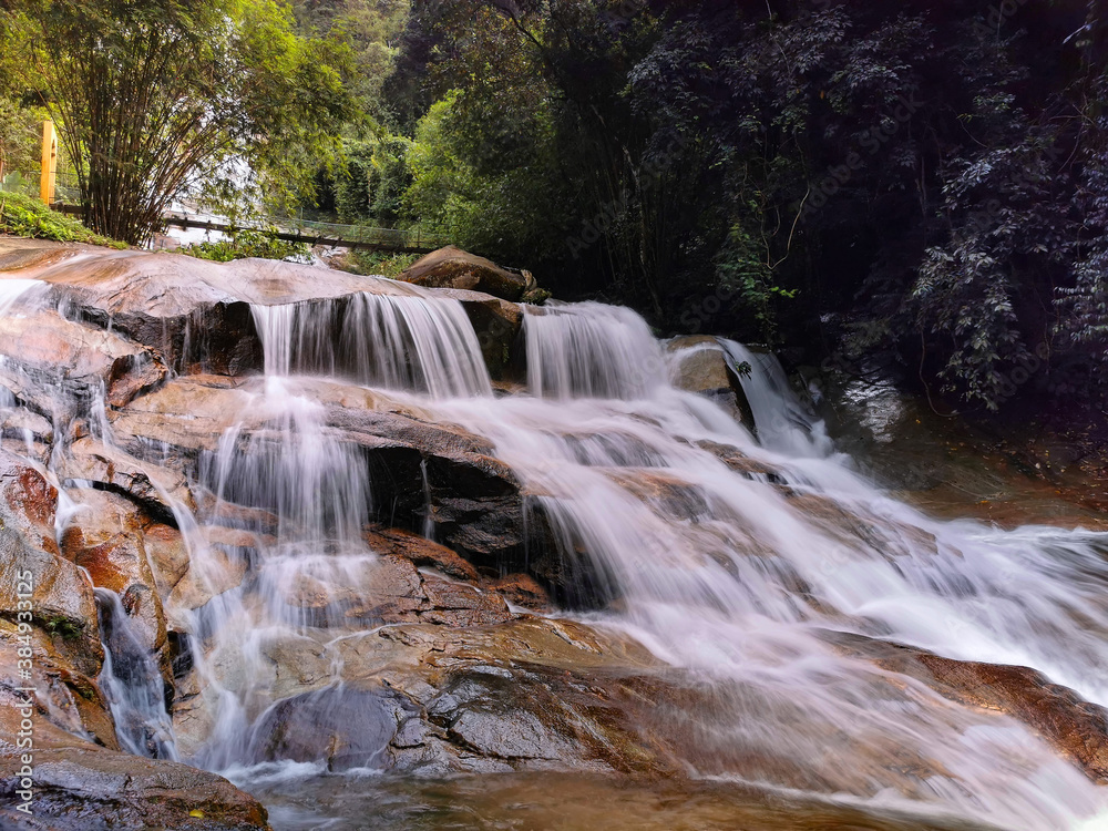 Fototapeta premium A view of waterfall in forest. Lata Kinjang is located about 18 km from Tapah in state of Perak, Malaysia. 