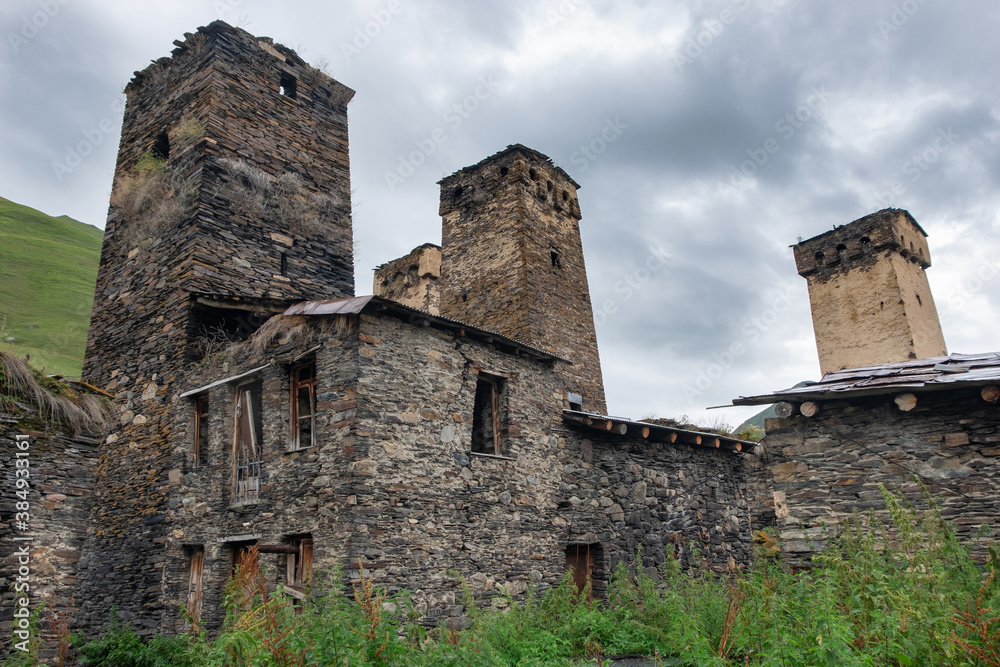 Traditional ancient Svan Towers and houses in Ushguli, a village recognized as the UNESCO World Heritage Site and one of the highest inhabited settlements in Europe, Svaneti, Georgia. Selective focus.