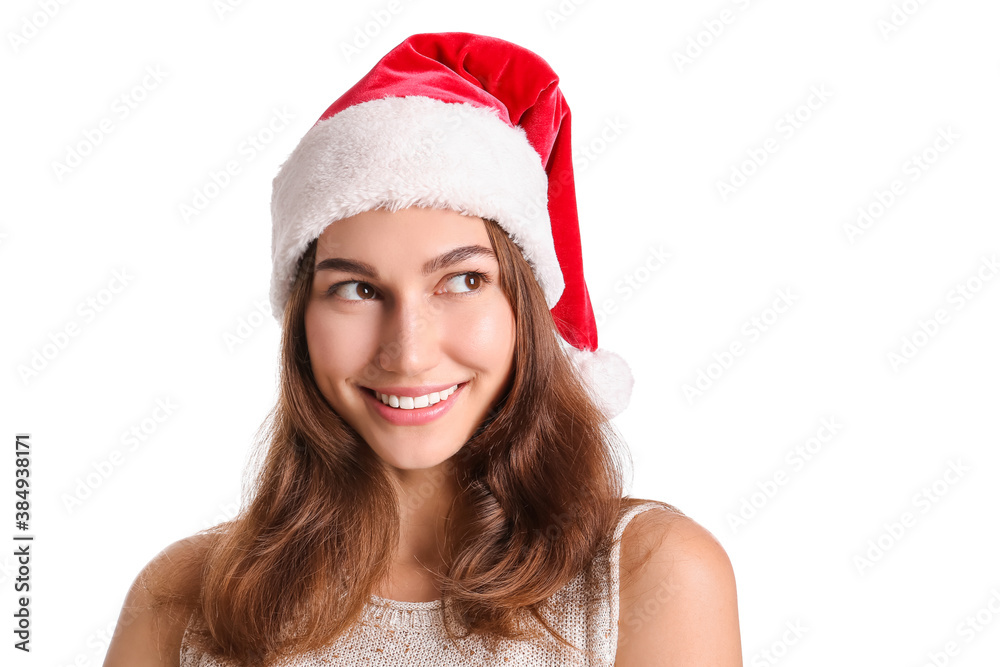 Beautiful young woman in Santa hat on white background Beautiful young woman in Santa hat on white background