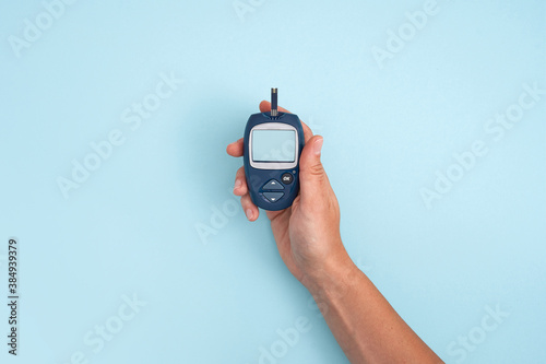 Healthy lifestyle concept. Health care. Medical diabetes meter equipment. Top view of glucose blood test. World diabetes health day. photo