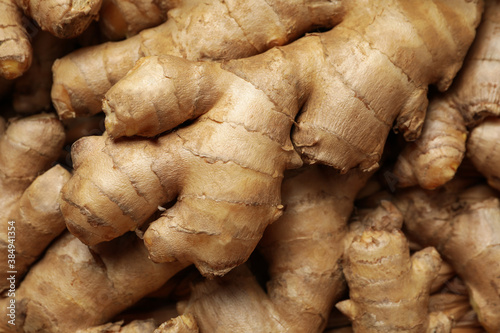 Canvas Print Fresh raw ginger on whole background, close up