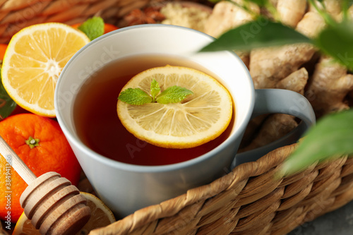 Basket with ginger, orange, lemon and tea