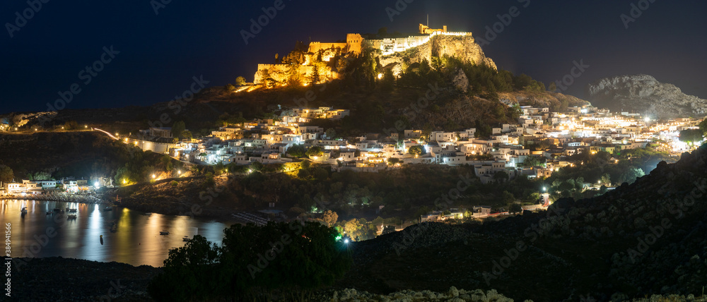 panoramic view of Lindos, town, fortress and Acropolis. Night photography. Rhodes, Greece