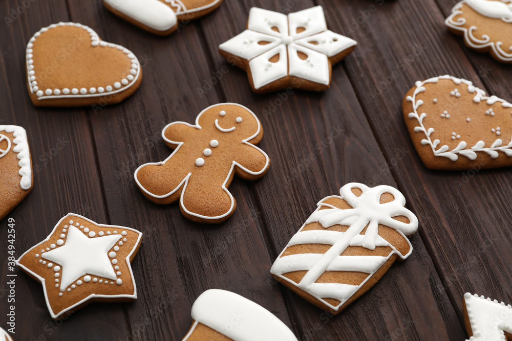 Many different delicious Christmas cookies on wooden table