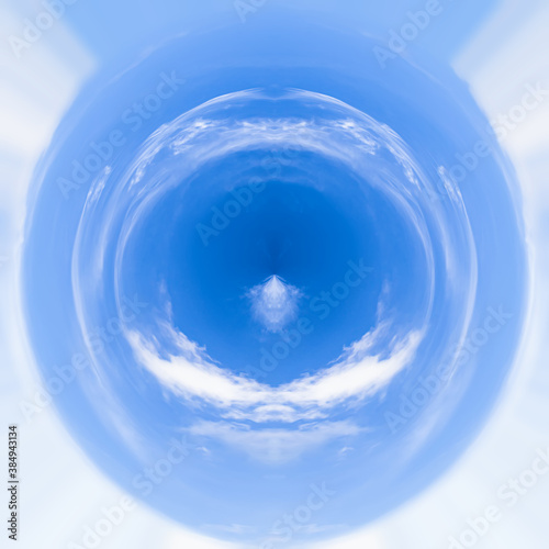 A piece of warm summer sky. Polar coordinates  a circular image of soft clouds in a bright blue sky. Natural beauty. Gelendzhik  Russia