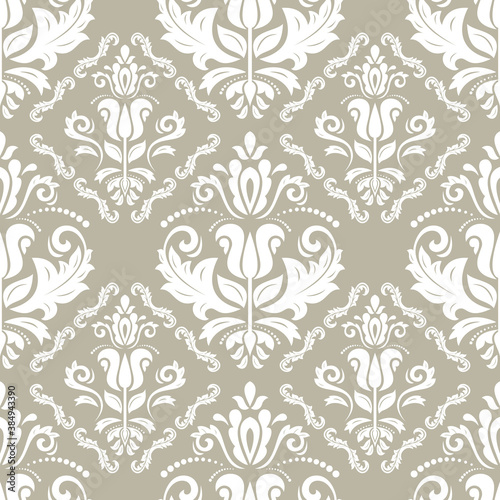 Classic seamless vector pattern. Damask orient ornament. Classic vintage beige and white background. Orient ornament for fabric, wallpaper and packaging