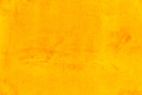 Yellow cement wall with orange gradient as background for creative ideas and text