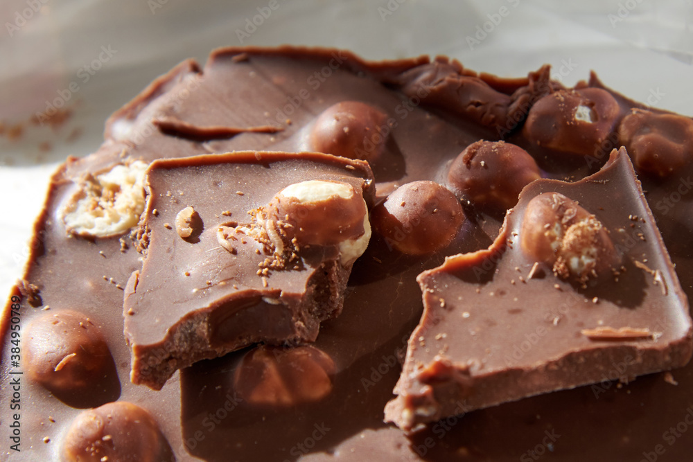 Chocolate with whole nuts eaten by small worms. Chocolate with whole nuts eaten by small worms.