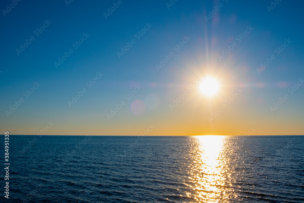Beautiful sunset on the sea with golden sky, great design for any purposes. Summer nature landscape. Travel concept background. Sea landscape.