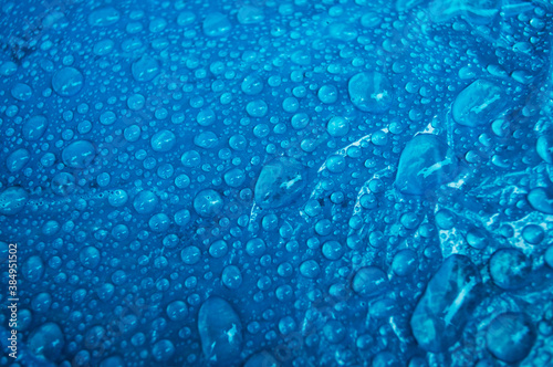 Rain drops on abstract blue background