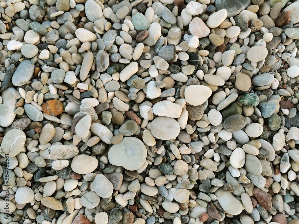 Colored stones. Stones on the beach. Small and big stones on the beach. Colored stones. Stones on the beach. Small and big stones on the beach.