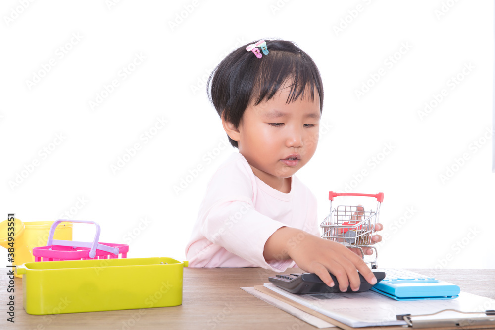 Cute little yellow girl playing a shopping game Cute little yellow girl playing a shopping game