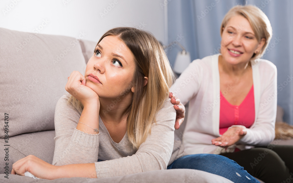 Obraz premium Kind mother comforts and supports her adult daughter after failure.