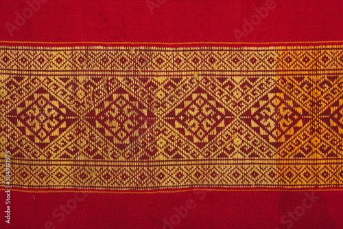 More than 100 years old colorful thai handcraft peruvian style rug surface old vintage torn conservation Made from natural materials Chemical free close up. photo