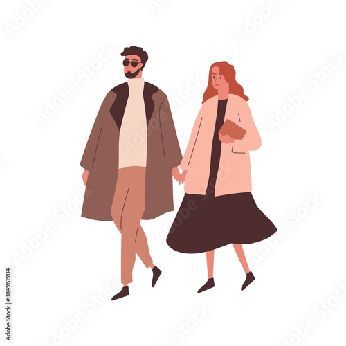 Modern couple holding hands and walking. Stylish girlfriend and boyfriend str...