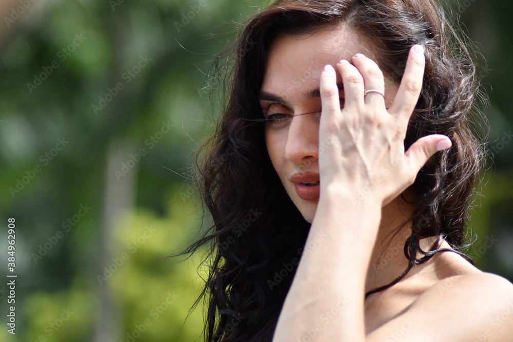Woman with fair skin thinking and looking sideways in a park in summer Woman with fair skin thinking and looking sideways in a park in summer