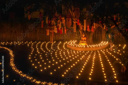 Tableau sur toile Loy Krathong festival ,Buddhist monk light candles to the Buddha in Phan-Tao Temple, Chiangmai, Thailand