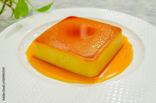 Closeup of Caramel Bread Pudding with caramalized sugar sauce - Beautiful & Sweet Dessert Dish photo