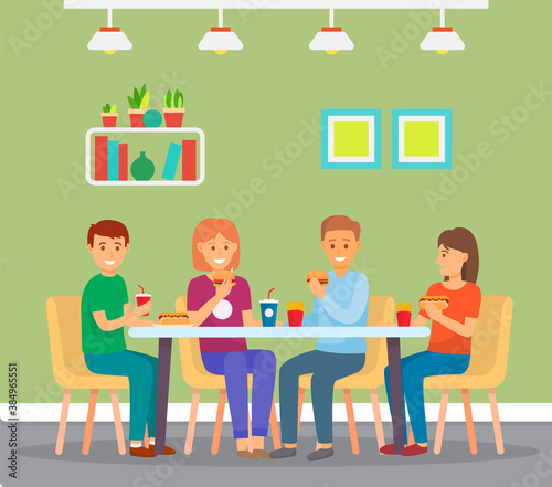 Happy group of friends eating fast food, sitting in cafe indoors, burgers, french fries, soda drink. Group of people spend leisure time together in cafeteria. Girls and guys enjoy of rest. Time to eat