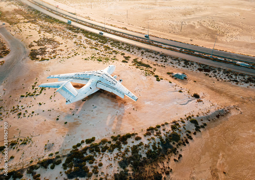 Deserted airplane in the in the Umm Al Quwain desert in the emirate of the United Arab Emirates photo