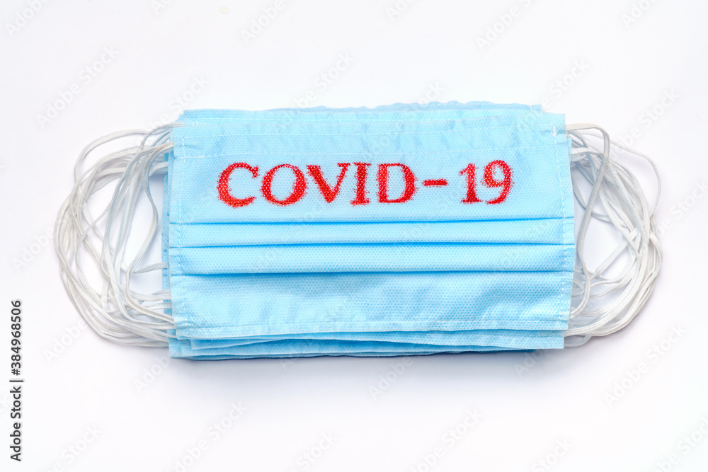 coronavirus COVID-19 pandemic concept - stack of antiviral surgical protective medical mask for protection against corona virus coronavirus COVID-19 pandemic concept - stack of antiviral surgical protective medical mask for protection against corona virus