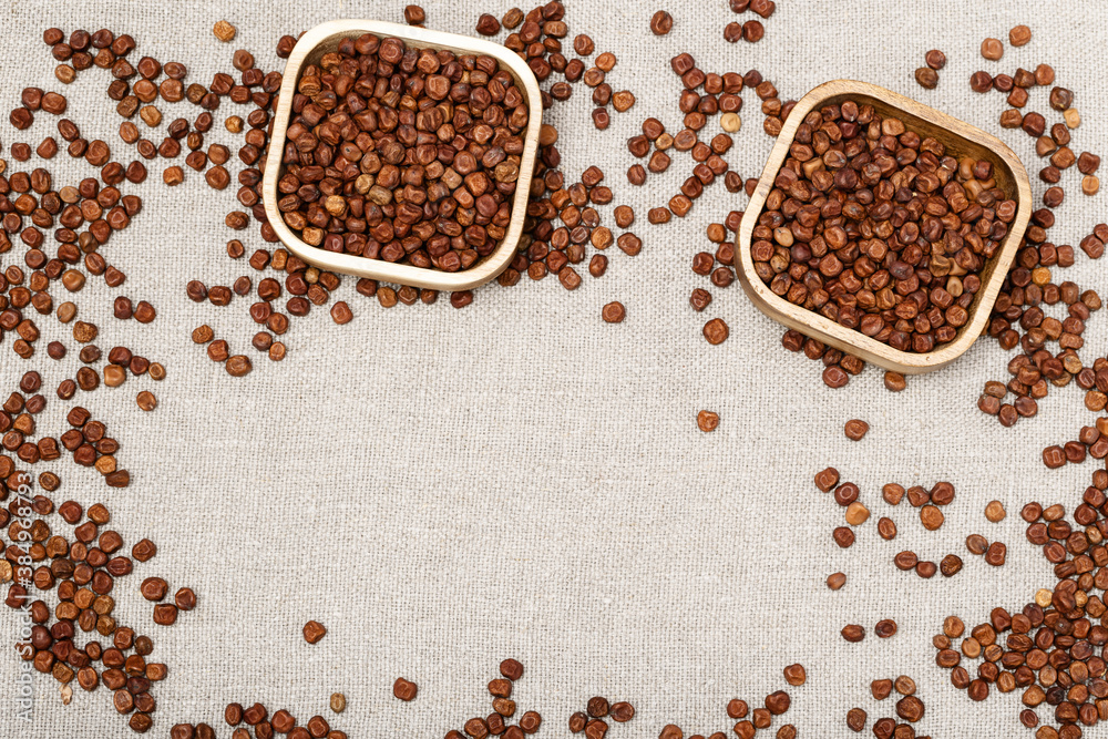 Full plates with legumes bean seed gray peas on wooden background with copy space. Healthy eating. Rustic style. Traditional Latvian product. Full plates with legumes bean seed gray peas on wooden background with copy space. Healthy eating. Rustic style. Traditional Latvian product.
