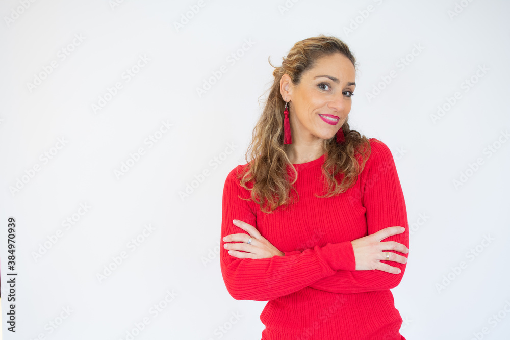 Beautiful woman wearing casual red sweater with arms crossed. Beautiful woman wearing casual red sweater with arms crossed.