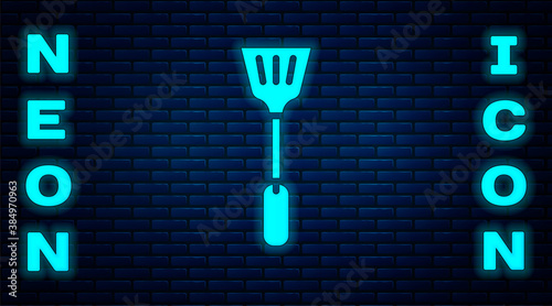 Glowing neon Fly swatter icon isolated on brick wall background. Vector.