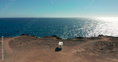 Aerial view. Camper van on a parking lot on a rock near the atlantic ocean. RV park.