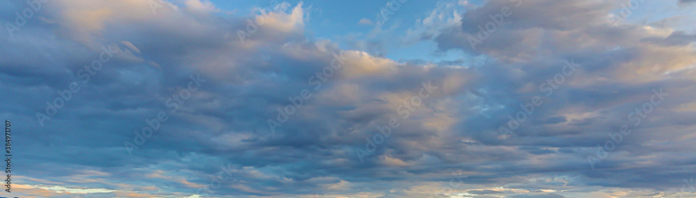Fototapeta premium Dramatic colorful sky with afterglow and illuminated clouds