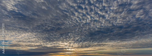 Dramatic colorful sky with afterglow and illuminated clouds