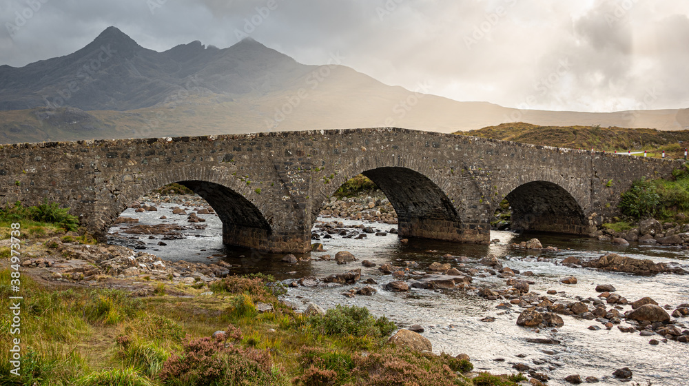Fototapeta premium Crossing the river Sligachan at Sligachan is the old three arched bridge