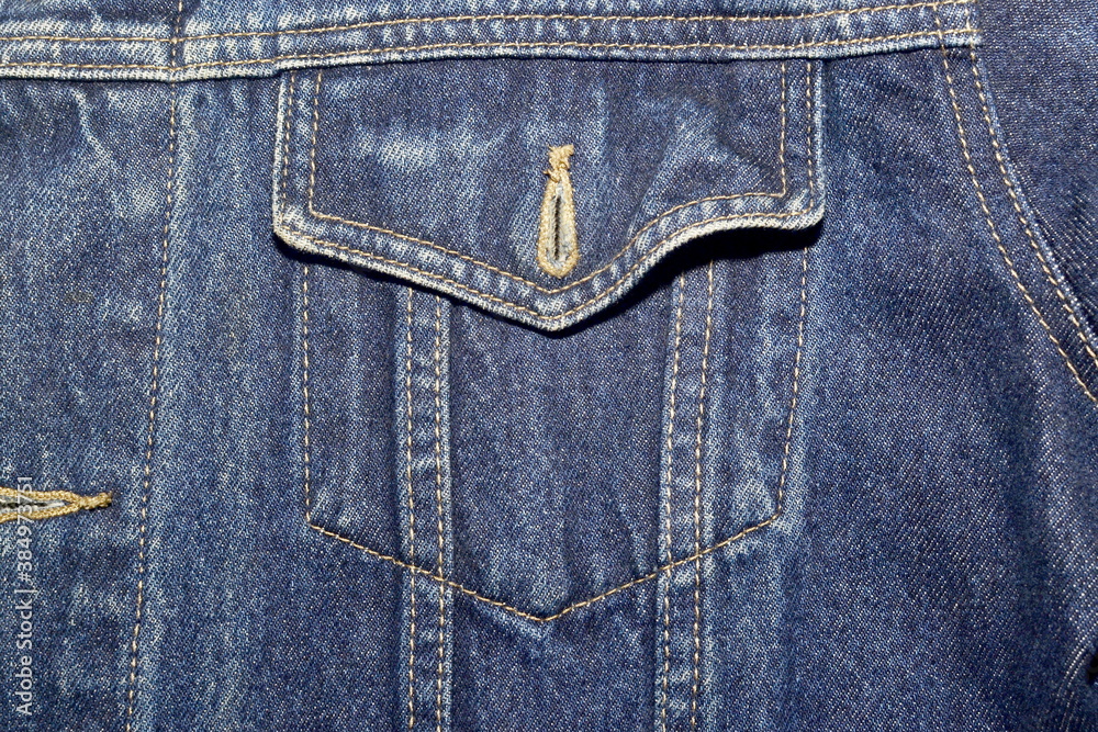 Front pocket of denim jacket classic design closeup Front pocket of denim jacket classic design closeup