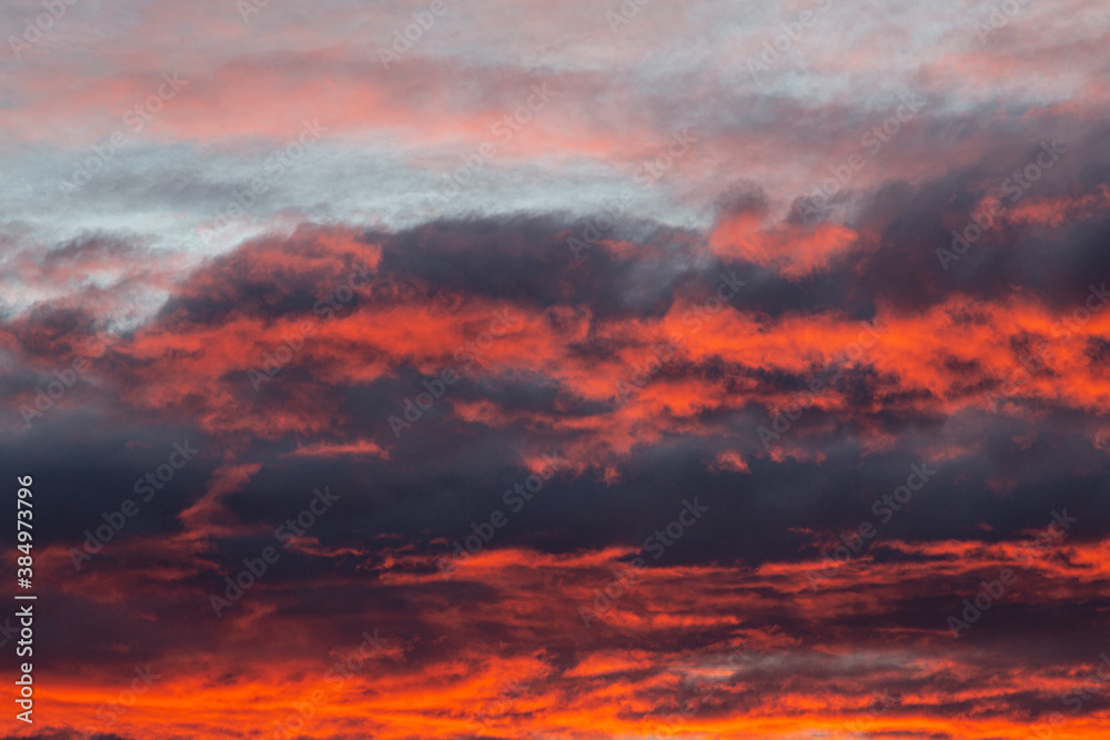 Dramatic colorful sky with afterglow and illuminated clouds Dramatic colorful sky with afterglow and illuminated clouds