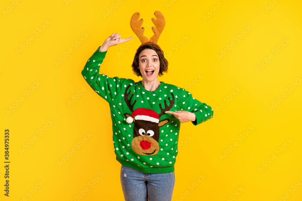 Shocked surprised crazy girl impressed x-mas christmas time celebration costume point finger antlers reindeer decor pullover headband isolated bright shine color background