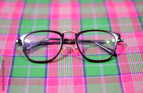 Photo of glasses on checkered fabric