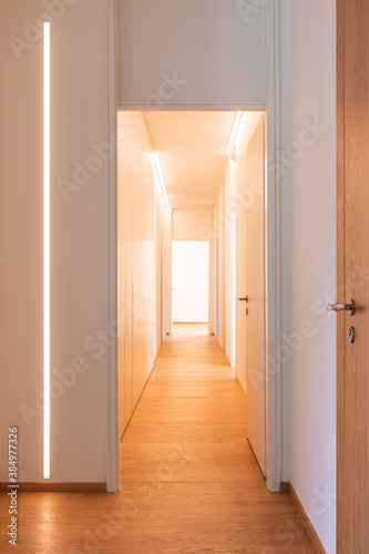 Fotografia Corridor detail with door and led strip. Minimal apartment