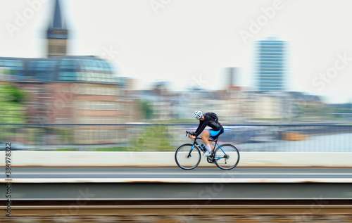 Cyclists in the city on a bridge