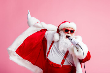 2021 coming sing song mic funky grey beard santa claus pop star have x-mas christmas live concert wear suspenders sunglass headwear cap isolated over pastel color background