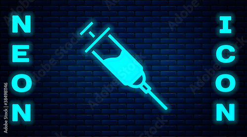 Glowing neon Doping syringe icon isolated on brick wall background. Vector.