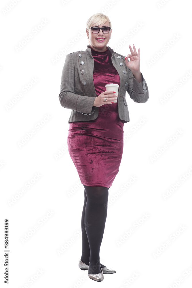 casual young woman with takeaway coffee showing thumbs up. casual young woman with takeaway coffee showing thumbs up.