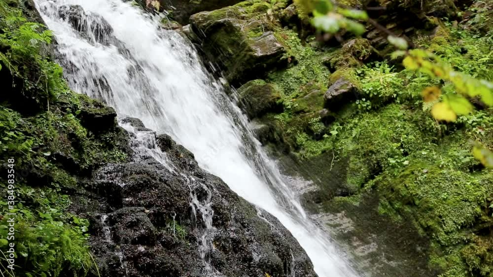 Wonderful waterfall on the mountain river Carpathians. Waterfall, fast mountain water, National Park of Skole Beskydy, Ukraine. Carpathian river, fast current, crystal water, pristine nature. Wonderful waterfall on the mountain river Carpathians. Waterfall, fast mountain water, National Park of Skole Beskydy, Ukraine. Carpathian river, fast current, crystal water, pristine nature.