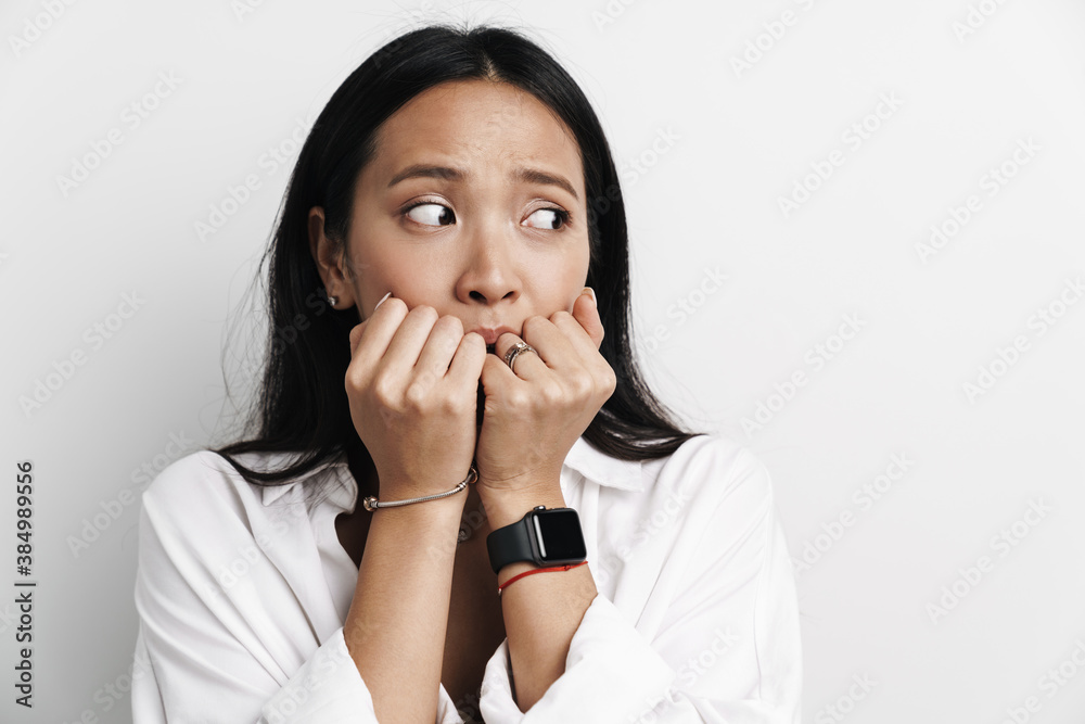 Beautiful shocked asian woman posing and looking aside Beautiful shocked asian woman posing and looking aside