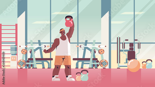 sportsman doing physical exercises with kettlebell working out fitness training healthy lifestyle concept modern gym studio interior full length horizontal vector illustration