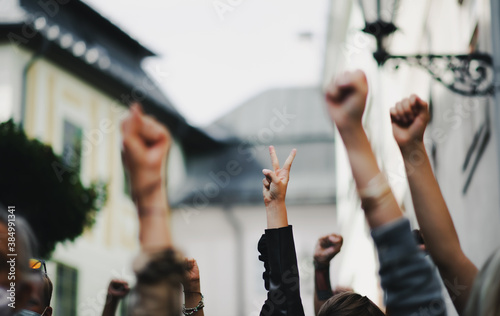 Arms and fists raised in the air, protest and demonstration concept.