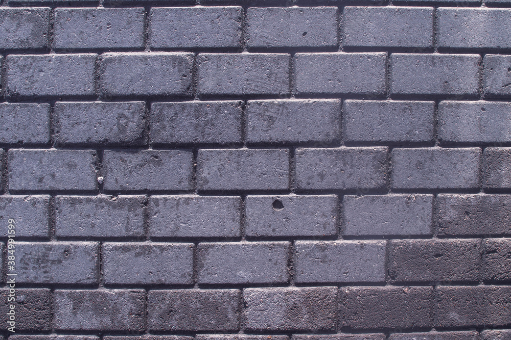 Paving slabs on the sidewalk. Small bricks on the road. Dirty, wet sidewalk. Background. Paving slabs on the sidewalk. Small bricks on the road. Dirty, wet sidewalk. Background.