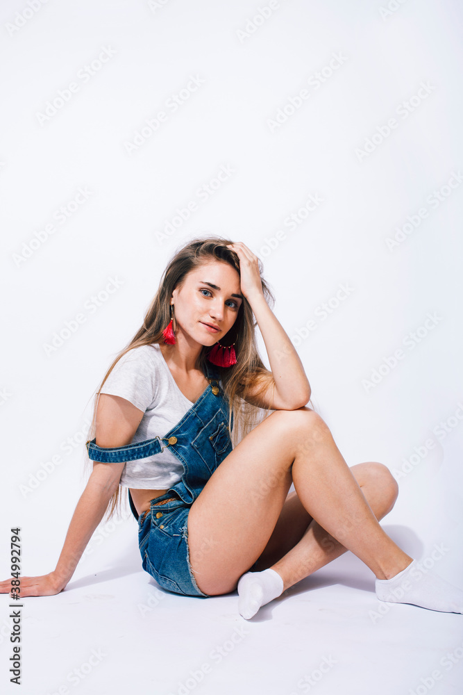 Obraz premium young pretty teenage girl posing cheerful on white background isolated, lifestyle people concept