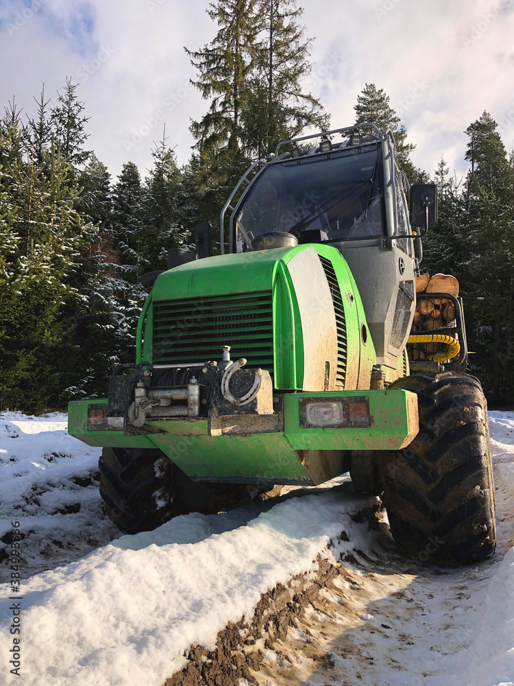 A special forest export truck Forwarder  transports logs for storage. A means of transport sensitive to the forest ecosystem