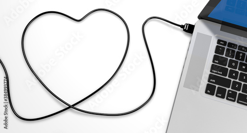 a usb cable plugged into a laptop, draw the shape of a heart